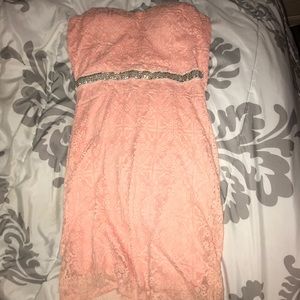 It’s a beautiful coral lace dress!